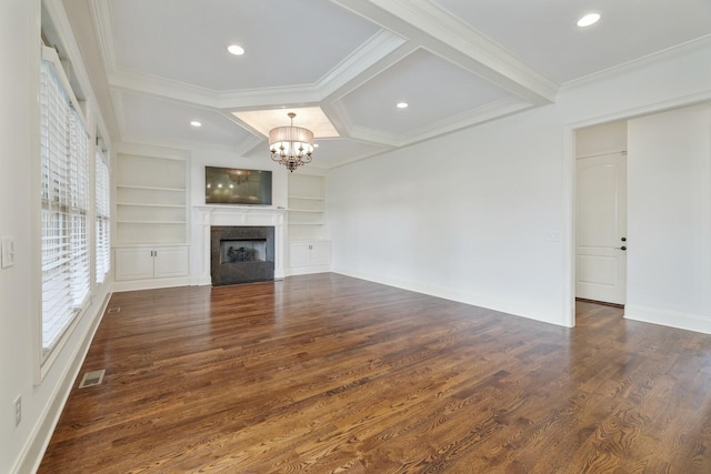 unfurnished living room featuring crown molding, coffered ceiling, a fireplace, and wood finished floors