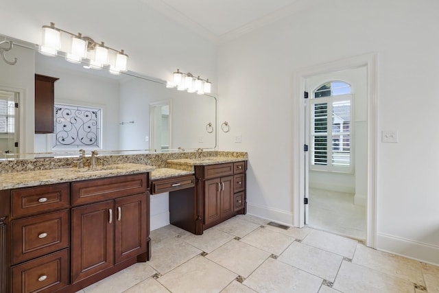 full bath with tile patterned flooring, ornamental molding, baseboards, and vanity