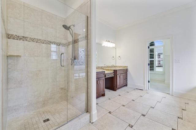 bathroom featuring baseboards, a stall shower, vanity, and crown molding