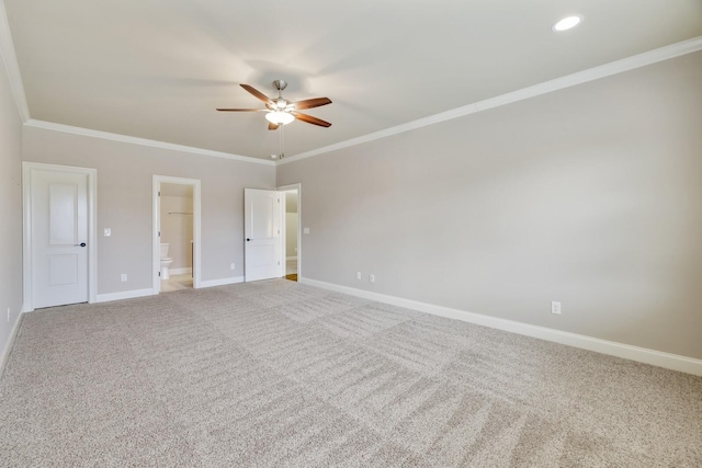 unfurnished bedroom featuring light carpet, baseboards, ceiling fan, ornamental molding, and ensuite bathroom