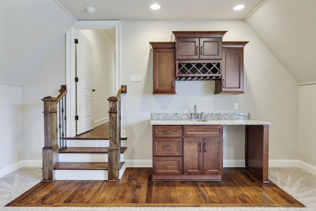 bar with baseboards, stairway, indoor wet bar, a sink, and recessed lighting