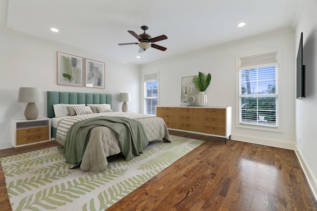 bedroom featuring recessed lighting, multiple windows, baseboards, and wood finished floors