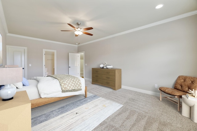 carpeted bedroom with baseboards, ceiling fan, ornamental molding, ensuite bathroom, and recessed lighting