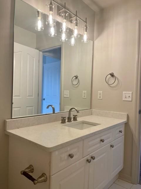 bathroom with tile patterned flooring and vanity