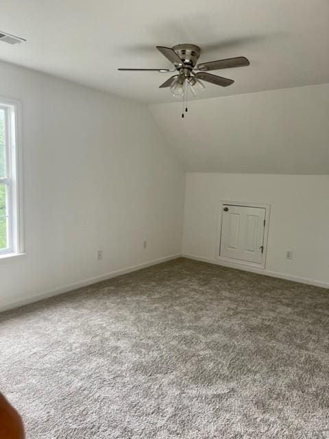 bonus room featuring carpet, visible vents, ceiling fan, and lofted ceiling