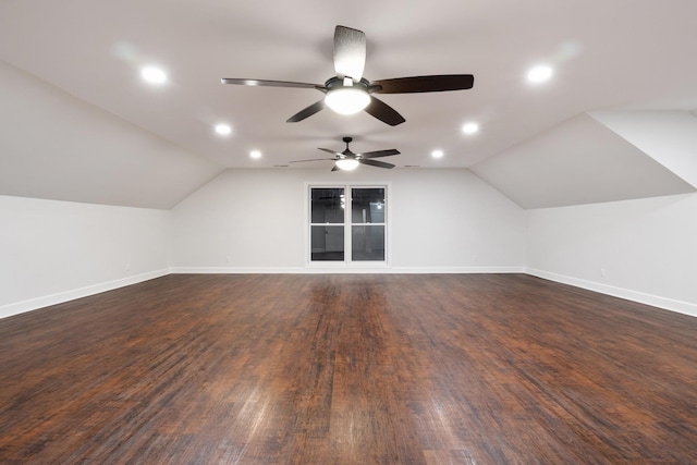 additional living space with lofted ceiling, recessed lighting, dark wood finished floors, and baseboards