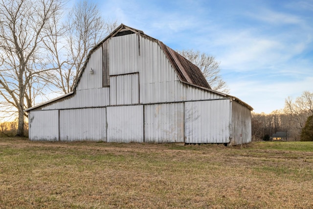 view of barn with a lawn