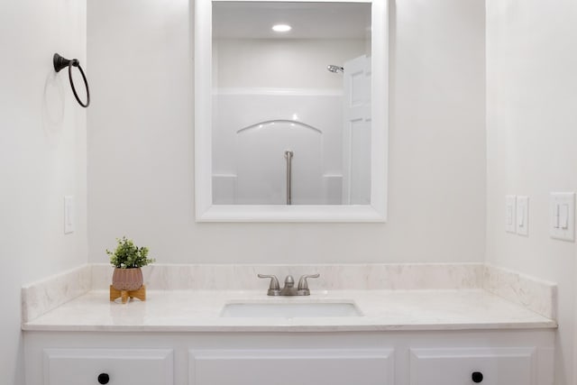 full bath with a shower and vanity