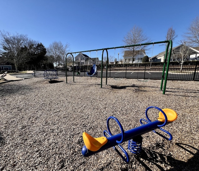 community play area featuring fence