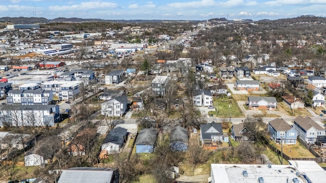 birds eye view of property with a mountain view and a residential view