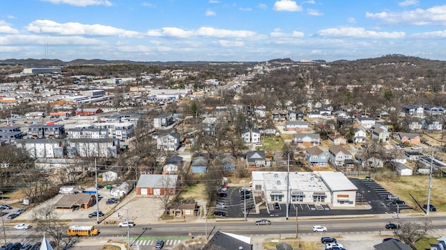 birds eye view of property with a mountain view