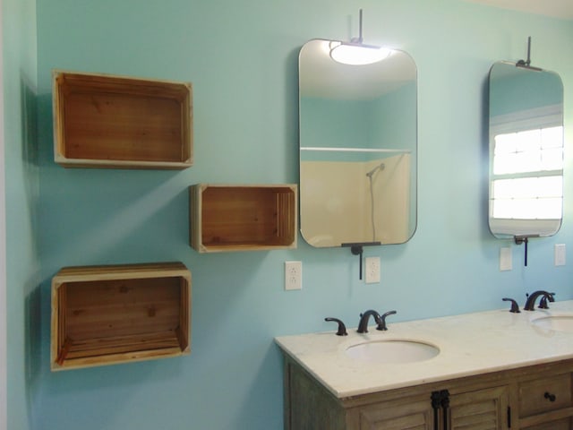 bathroom featuring double vanity and a sink