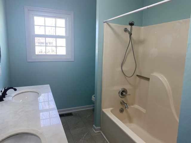 bathroom with baseboards, visible vents, bathing tub / shower combination, toilet, and vanity