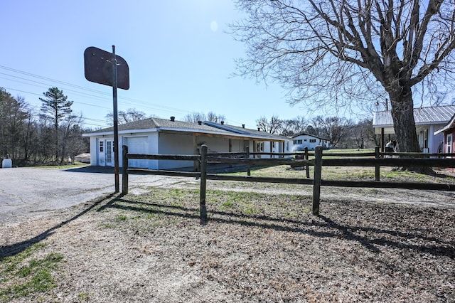 view of property exterior featuring fence