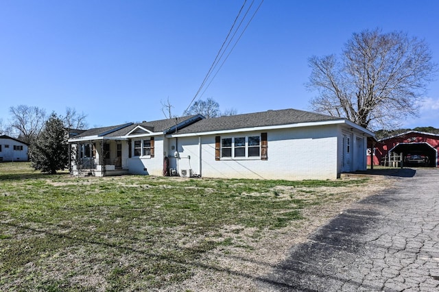 ranch-style home with a front lawn, a porch, and brick siding