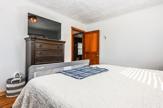 bedroom with wood finished floors