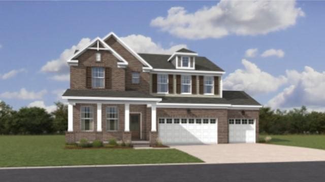 view of front of home with driveway, a garage, and a front yard