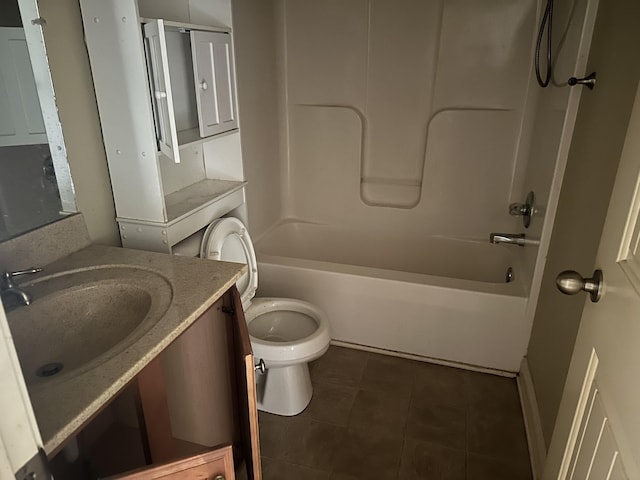 bathroom with washtub / shower combination, vanity, tile patterned flooring, and toilet