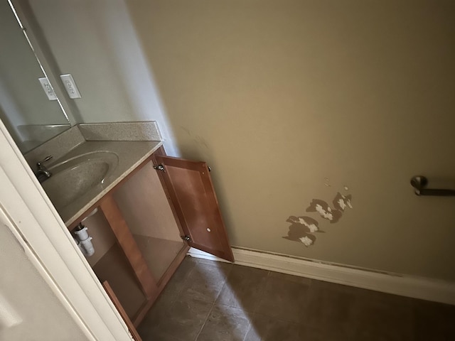 bathroom featuring tile patterned floors, vanity, and baseboards