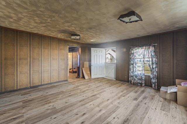 spare room featuring light wood-style floors