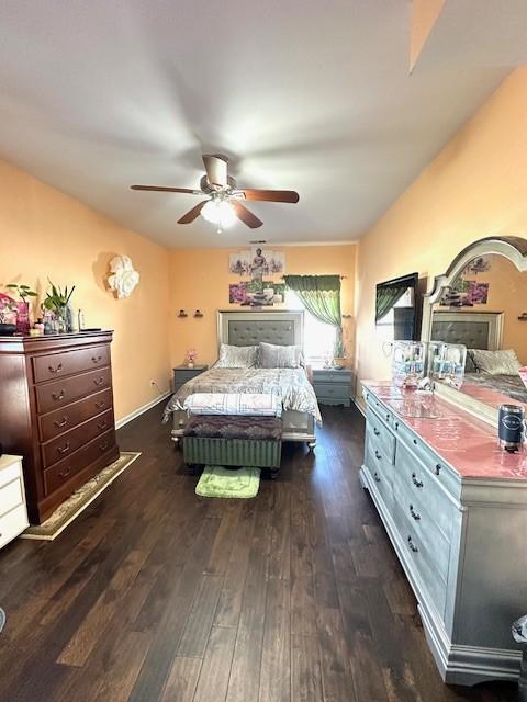 bedroom featuring ceiling fan and wood finished floors