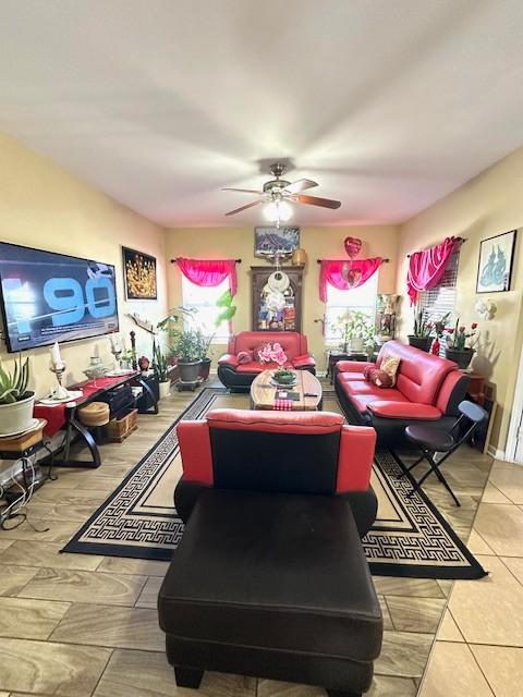 living area featuring ceiling fan