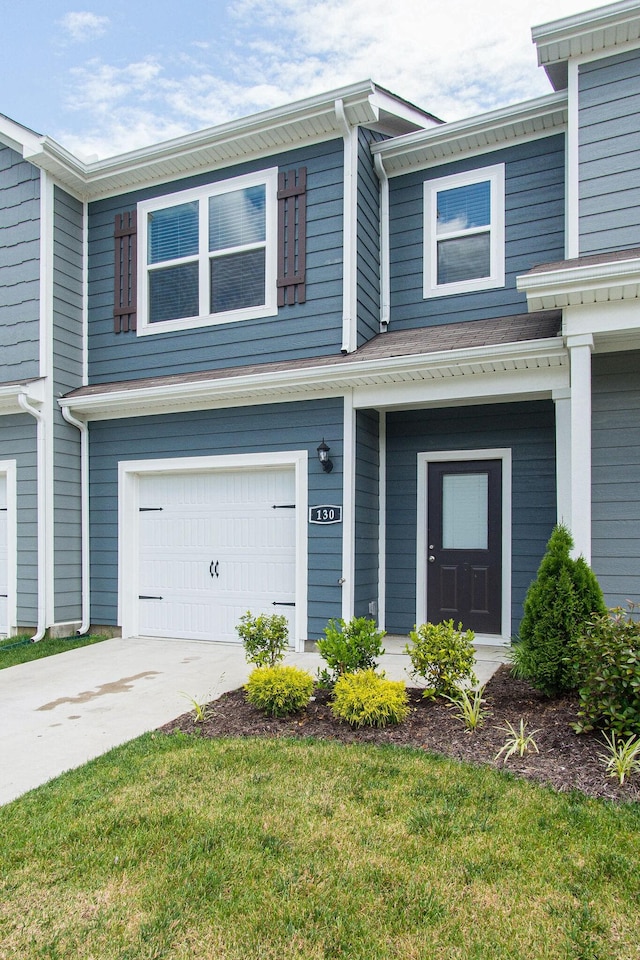 view of front of property featuring a garage and driveway