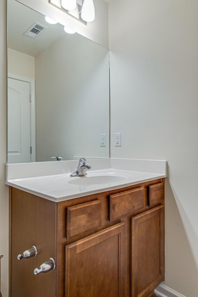 bathroom with visible vents and vanity