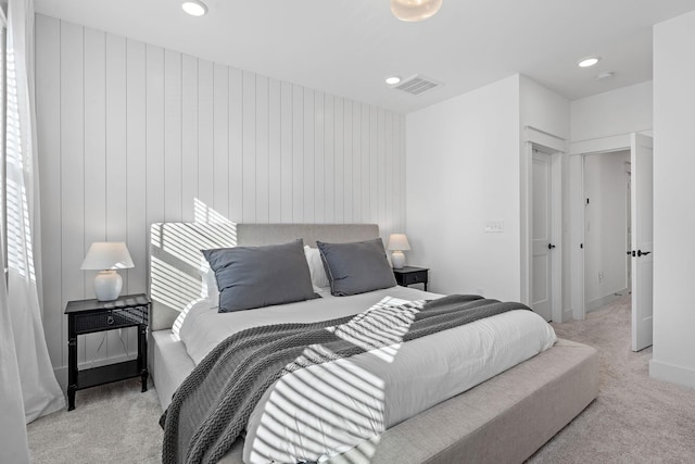 carpeted bedroom with recessed lighting and visible vents