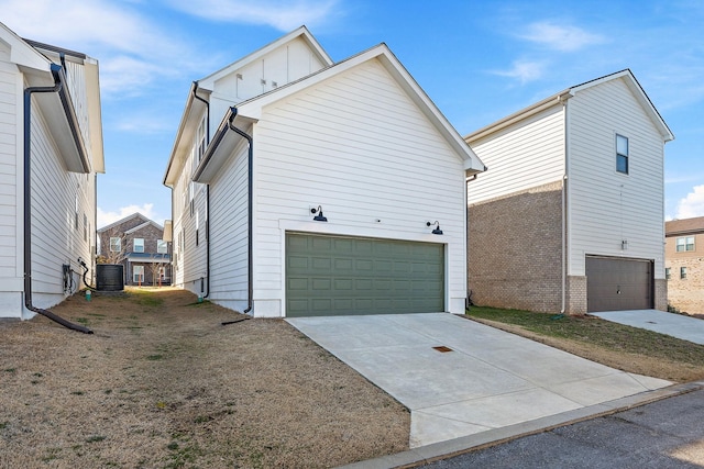 view of property exterior featuring a garage and central air condition unit