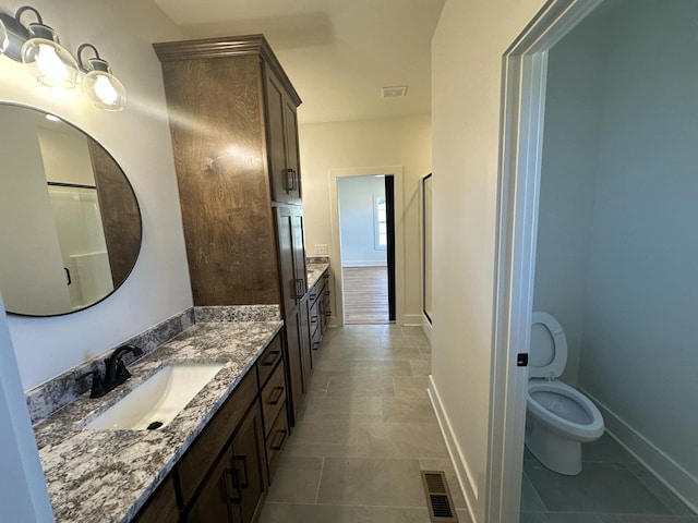 full bathroom featuring visible vents, vanity, and baseboards