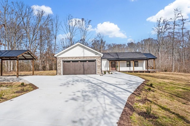 view of front of property featuring driveway, covered porch, a garage, and brick siding