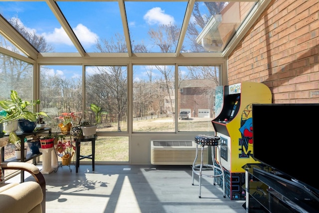 sunroom featuring a wall unit AC