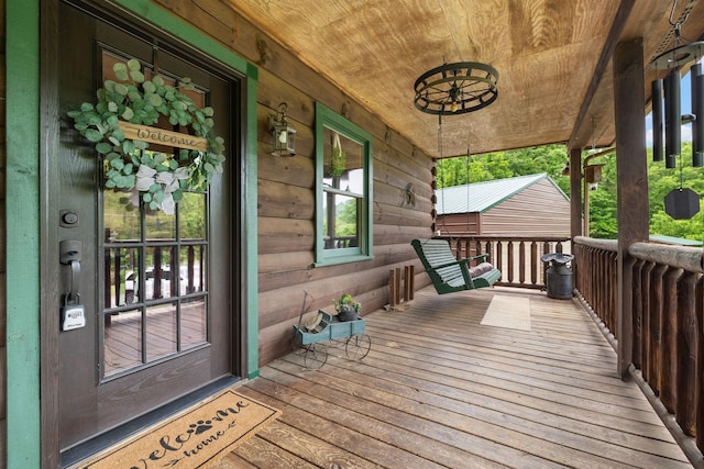 wooden terrace with a porch