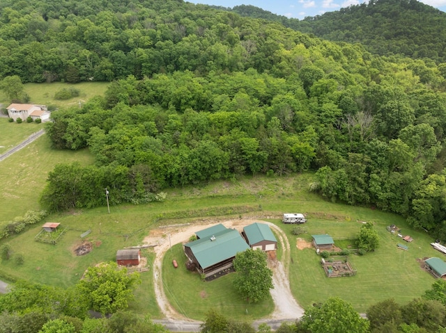 bird's eye view featuring a forest view