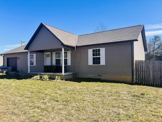 view of front facade featuring an attached garage, covered porch, fence, crawl space, and a front lawn