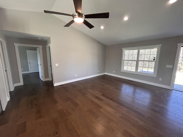 spare room with high vaulted ceiling, recessed lighting, dark wood-style flooring, and baseboards