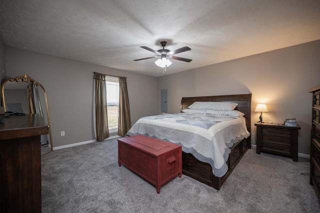 bedroom with baseboards, a textured ceiling, a ceiling fan, and light colored carpet