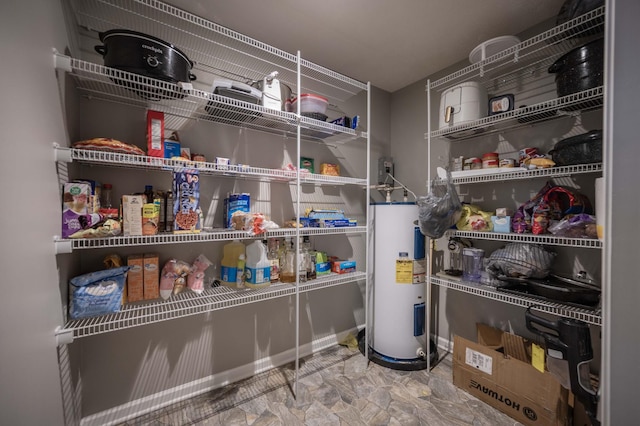 storage area featuring electric water heater