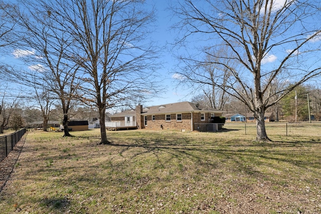 view of yard with fence and a deck