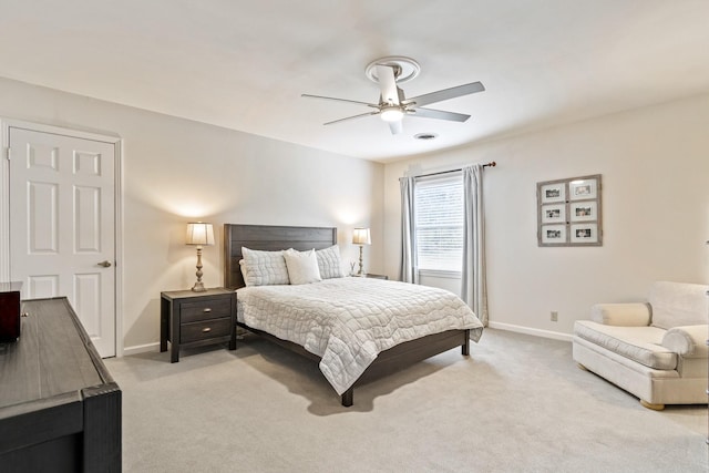 bedroom featuring baseboards, a ceiling fan, and light colored carpet