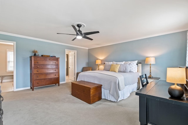 carpeted bedroom featuring crown molding, a ceiling fan, and baseboards