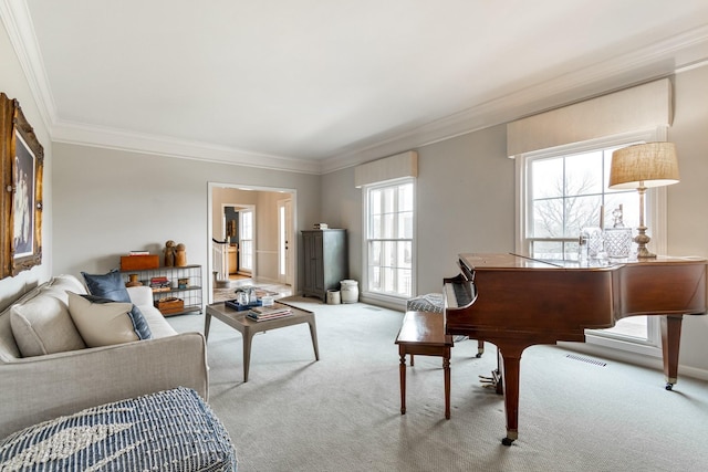 carpeted living area with ornamental molding