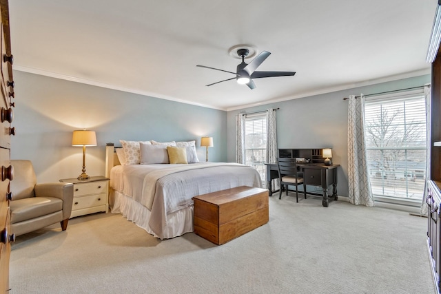 bedroom featuring carpet floors, ornamental molding, a ceiling fan, and baseboards