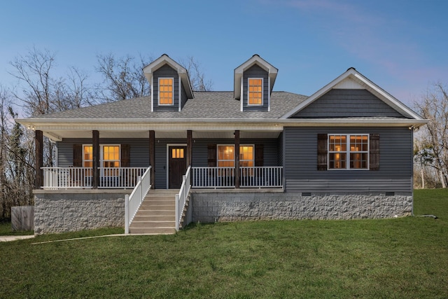 view of front of house featuring roof with shingles, a porch, crawl space, and a front yard