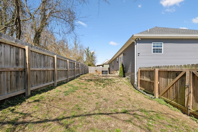 view of yard with a fenced backyard