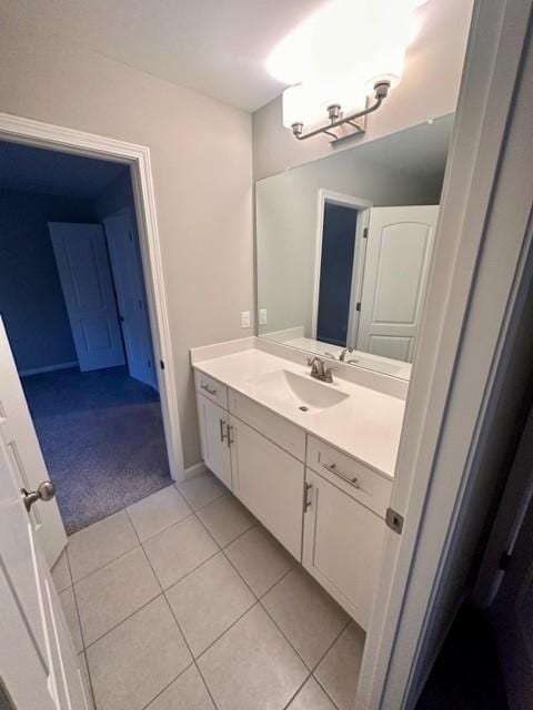 bathroom featuring tile patterned flooring and vanity