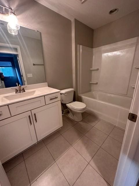 full bathroom featuring vanity, bathtub / shower combination, tile patterned flooring, and toilet