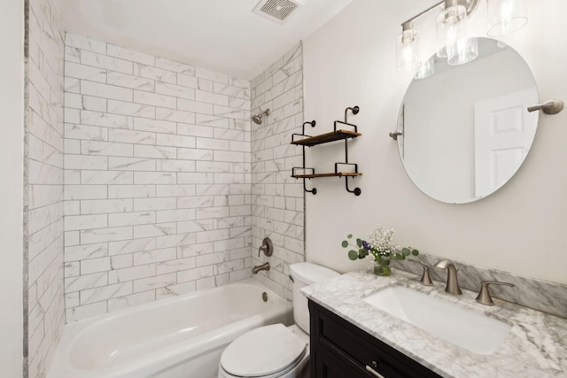 bathroom with toilet, shower / washtub combination, vanity, and visible vents