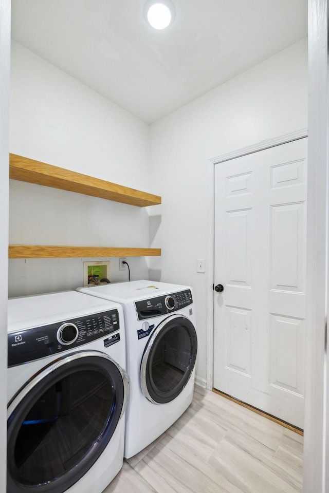 laundry area featuring laundry area and washing machine and dryer